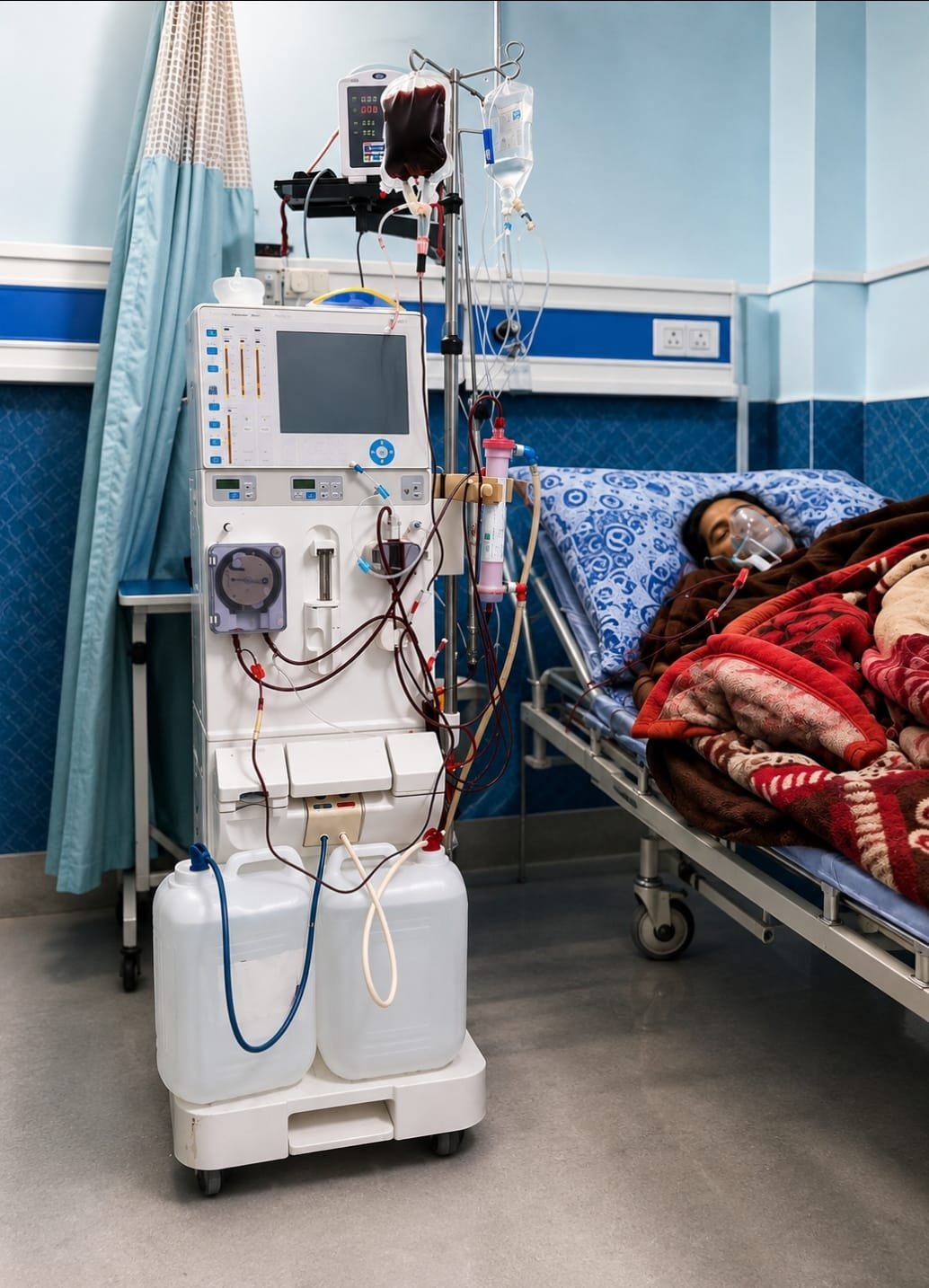 Dialysis machine beside a monitored patient bed